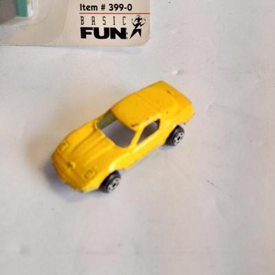 Hot wheels Keychain with assortment of other small cars and a motorcycle