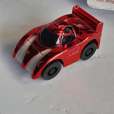 Hot wheels Keychain with assortment of other small cars and a motorcycle