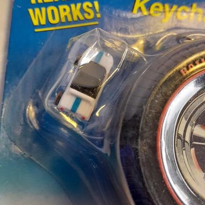 Hot wheels Keychain with assortment of other small cars and a motorcycle