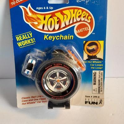 Hot wheels Keychain with assortment of other small cars and a motorcycle