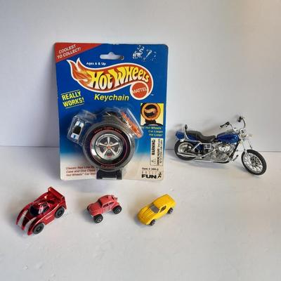 Hot wheels Keychain with assortment of other small cars and a motorcycle