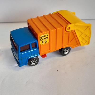 Two Semi Trucks one with trailer Road Champs, and Hot Wheels, and Matchbox Refuse Truck