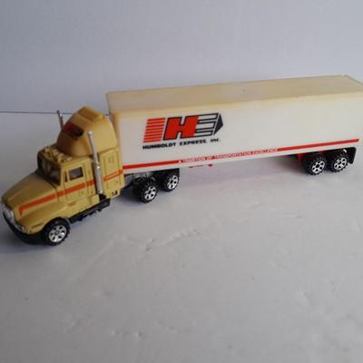 Two Semi Trucks one with trailer Road Champs, and Hot Wheels, and Matchbox Refuse Truck