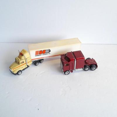Two Semi Trucks one with trailer Road Champs, and Hot Wheels, and Matchbox Refuse Truck