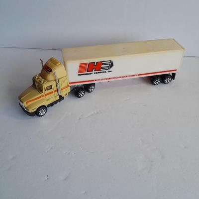 Two Semi Trucks one with trailer Road Champs, and Hot Wheels, and Matchbox Refuse Truck