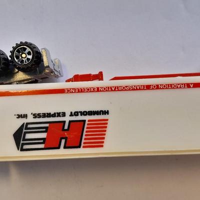 Two Semi Trucks one with trailer Road Champs, and Hot Wheels, and Matchbox Refuse Truck
