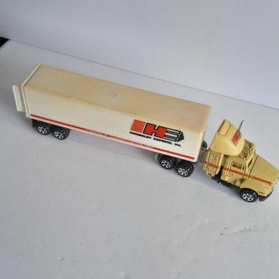 Two Semi Trucks one with trailer Road Champs, and Hot Wheels, and Matchbox Refuse Truck