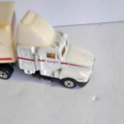 Two Semi Trucks one with trailer Road Champs, and Hot Wheels, and Hot Wheels Dump Truck