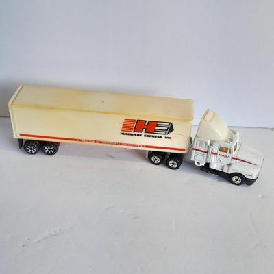 Two Semi Trucks one with trailer Road Champs, and Hot Wheels, and Hot Wheels Dump Truck