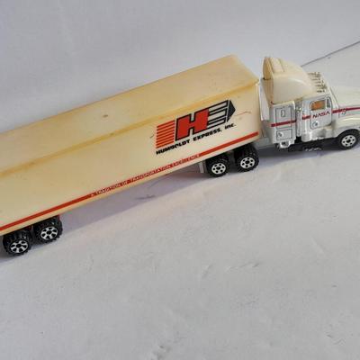 Two Semi Trucks one with trailer Road Champs, and Hot Wheels, and Hot Wheels Dump Truck