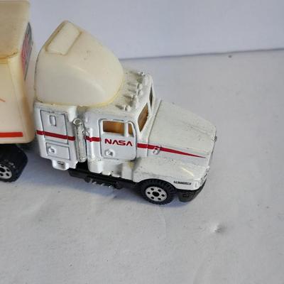 Two Semi Trucks one with trailer Road Champs, and Hot Wheels, and Hot Wheels Dump Truck