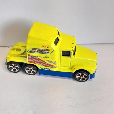 Two Semi Trucks one with trailer Road Champs, and Hot Wheels, and Hot Wheels Dump Truck
