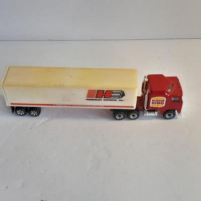 Three advertisement Semi Trucks and one trailer Road Champs, and Matchbox,