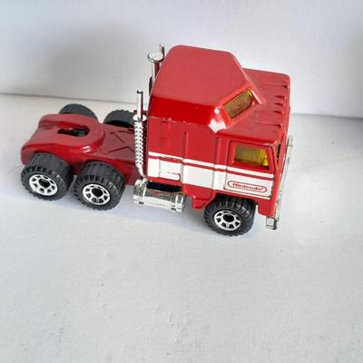 Three advertisement Semi Trucks and one trailer Road Champs, and Matchbox,