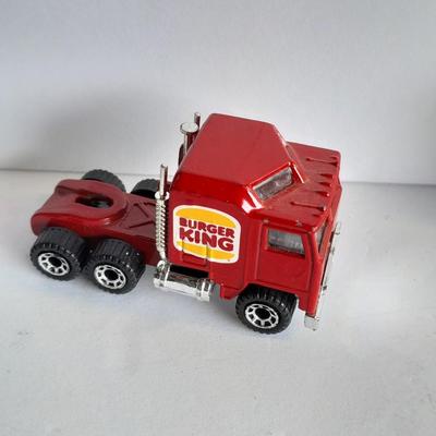 Three advertisement Semi Trucks and one trailer Road Champs, and Matchbox,