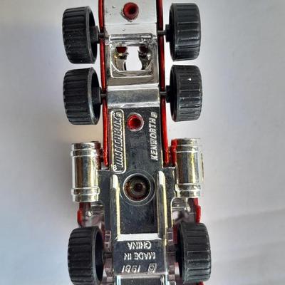 Three advertisement Semi Trucks and one trailer Road Champs, and Matchbox,
