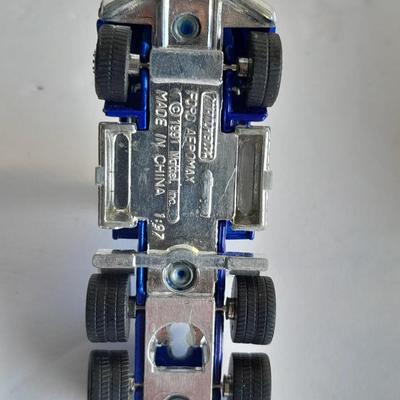 Three advertisement Semi Trucks and one trailer Road Champs, and Matchbox,