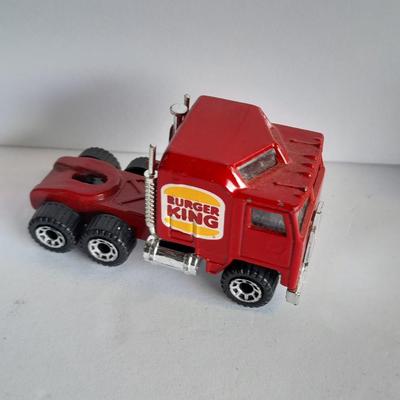 Three advertisement Semi Trucks and one trailer Road Champs, and Matchbox,