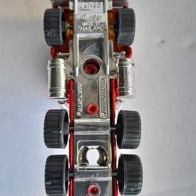 Three advertisement Semi Trucks and one trailer Road Champs, and Matchbox,