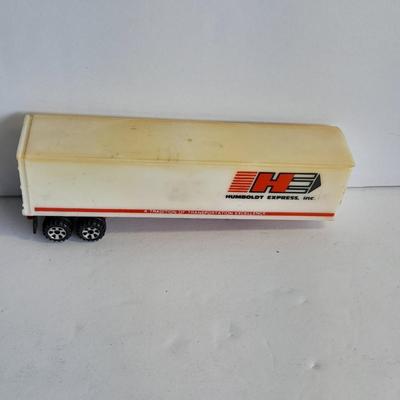 Three advertisement Semi Trucks and one trailer Road Champs, and Matchbox,