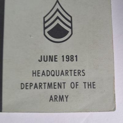 Military books, Field Guide booklets, and a Side cap