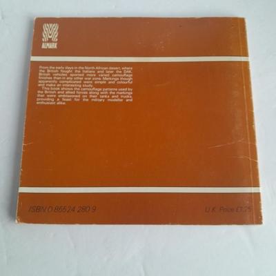 Military books, Field Guide booklets, and a Side cap