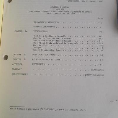 Military books, Field Guide booklets, and a Side cap