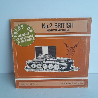 Military books, Field Guide booklets, and a Side cap