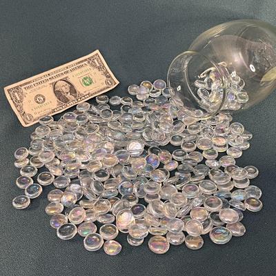 GLASS VASE FULL OF DECORATIVE FLATTENED MARBLES