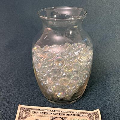 GLASS VASE FULL OF DECORATIVE FLATTENED MARBLES
