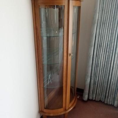 LIGHTED CURIO CABINET WITH MIRRORED BACK