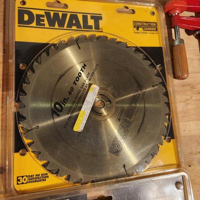 Table Lot of tools, DeWalt 10" Saw Blades, Metric Socket set Deep Wall Sockets, 6" Dado , Rivet Set, Clamps