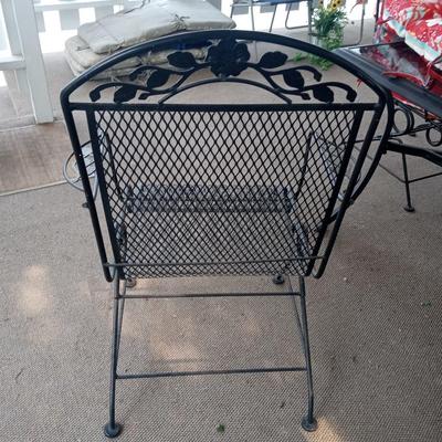 PATIO TABLE WITH 4 ARMED IRON ROCKING CHAIRS WITH LIKE NEW CUSHIONS