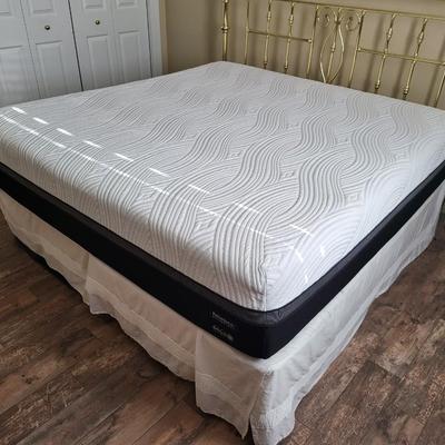 King Size Bed with Gold Headboard and Linen