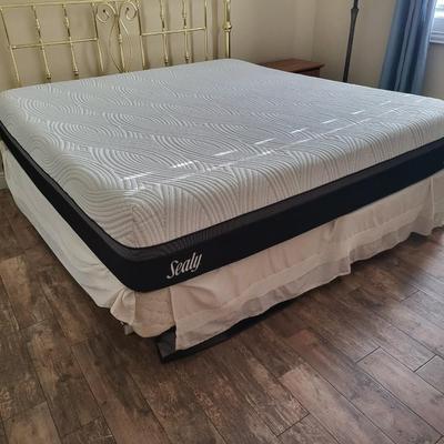 King Size Bed with Gold Headboard and Linen