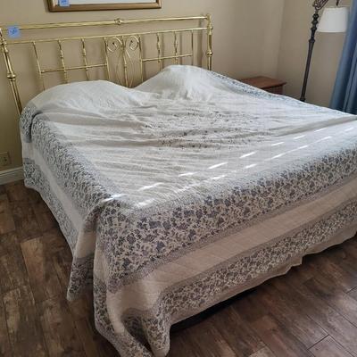 King Size Bed with Gold Headboard and Linen