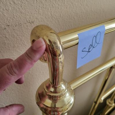 King Size Bed with Gold Headboard and Linen