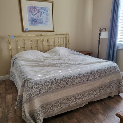 King Size Bed with Gold Headboard and Linen