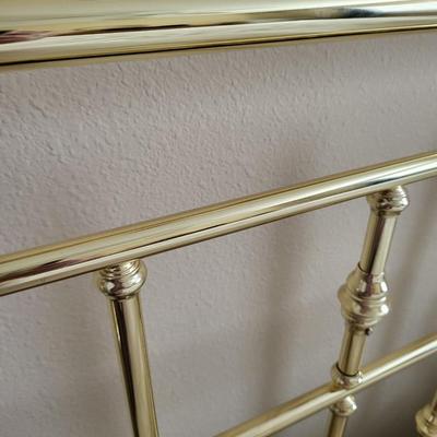 King Size Bed with Gold Headboard and Linen