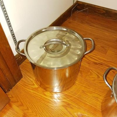 TWO STAINLESS STEEL STOCK POTS WITH LIDS