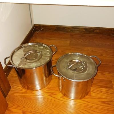 TWO STAINLESS STEEL STOCK POTS WITH LIDS