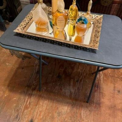 Name brand fragrances
and gilded vanity mirrored tray