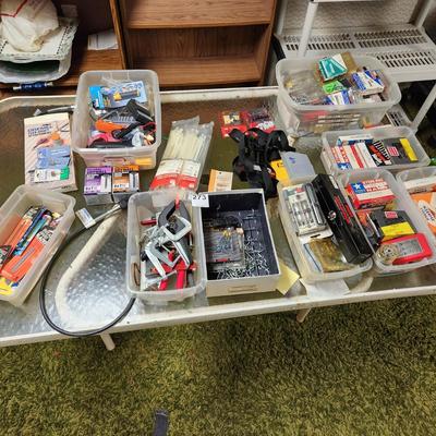 Table lot of hardware, nails, peg hooks, Dremel attachments,clamps,bits WYSIWYG