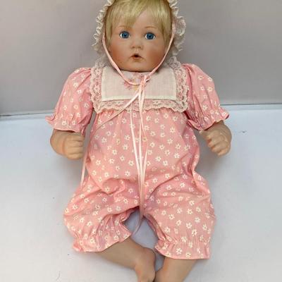 Porcelain Bisque Soft Body Baby Doll Blond Hair Blue Eyed Girl in Pink Outfit