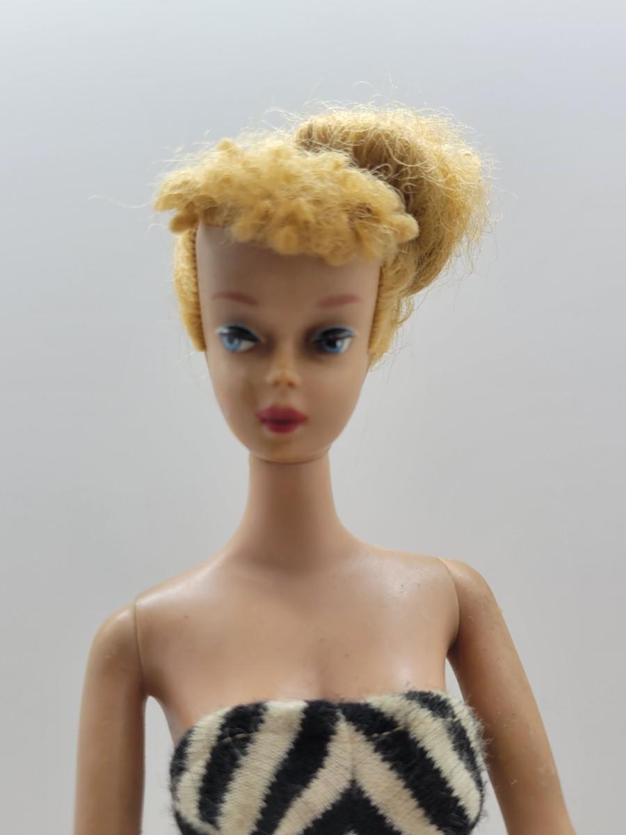 LOT 74 1958 MCMLVIII Barbie in Iconic Black and White Bathing Suit