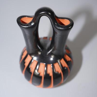 RED CLAY CARVED WEDDING VASE WITH POLISHED BLACK CLAY . SIGNED
