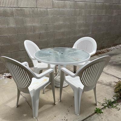 Small Glass Top Patio Table with Four Chairs