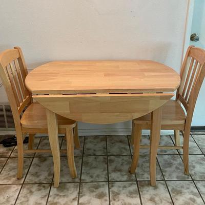Light finished Wood Table and Chairs Set Drop leaf style, 39â€ high, 42â€ round