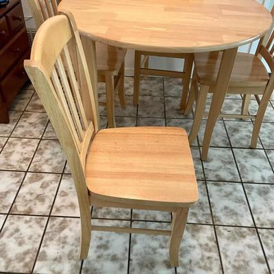 Light finished Wood Table and Chairs Set Drop leaf style, 39â€ high, 42â€ round