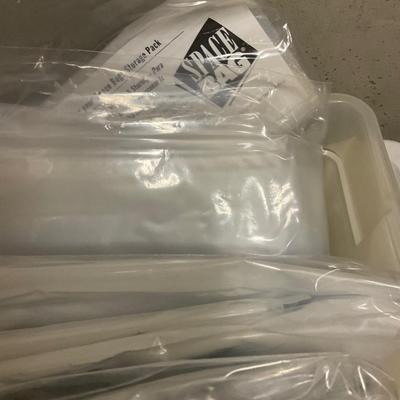 Three Storage Totes With Storage Jars, Hangers And Space Bags.